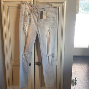 Brand new grey faded distressed jeans